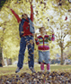 Daily Physical Activity photo of children jumping in autumn leaves.